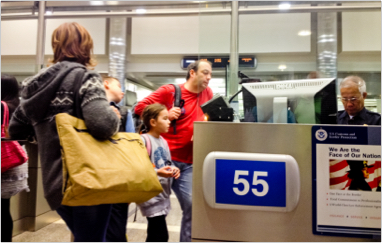 people getting inspected at an airport