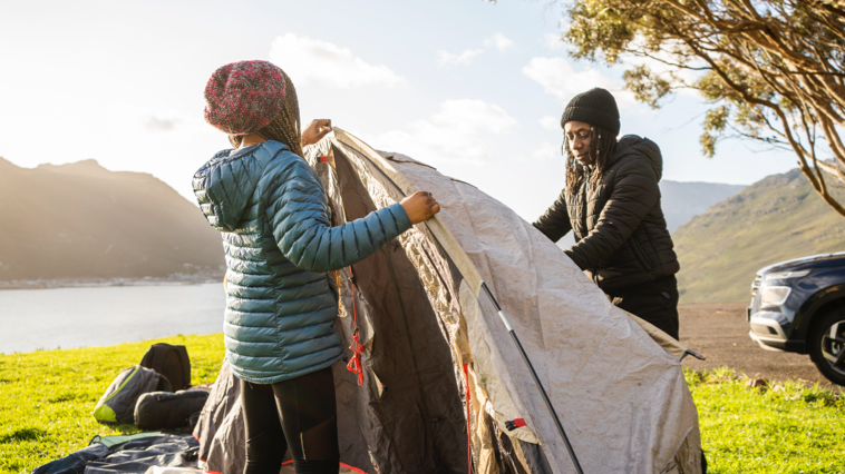 People setting up camping equipment